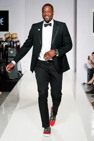 Fresh Off the Runway - Dwyane Wade makes his runway debut in a black tuxedo styled with custom animal print and patent leather shoes.(Photo: John Parra/WireImage)
