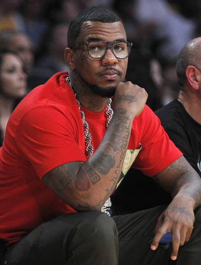 Game On - Rapper Jayceon Terrell Taylor, known by his stage name &quot;Game,&quot; sits courtside as he watches the Los Angeles Lakers play the Houston Rockets at the Staples Center in Los Angeles. (Photo: REUTERS /ALEX GALLARDO /LANDOV)