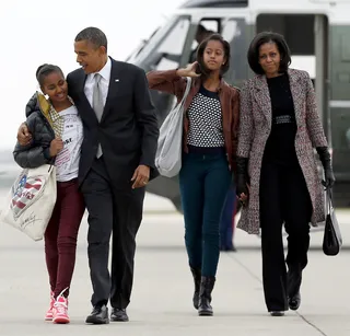 A United Front - An impromptu family shot as the family boards Air Force One the day after Election Day in 2012. (Photo:AP Photo/Carolyn Kaster)