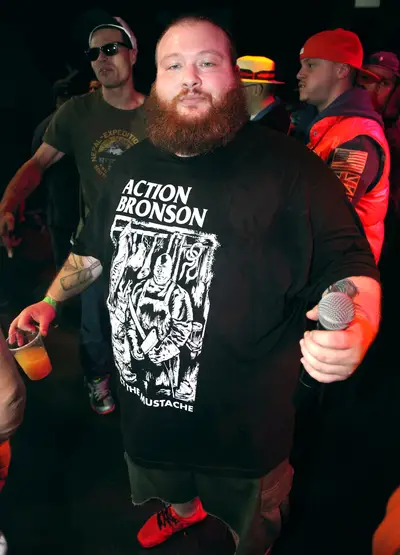 Action Bronson - During an&nbsp;Action Bronson&nbsp;show in North Carolina, an overzealous fan hopped up on the stage, apparently trying to share what he was smoking. The 300-plus pound Queens-bred emcee&nbsp;sent him reeling back into the crowd with a strong left and continued to rap with the mic in his right hand.(Photo: Johnny Nunez/WireImage)