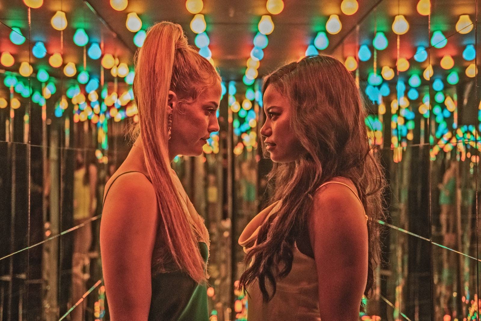 Riley Keough (left) stars as "Stefani" and Taylour Paige (right) stars as "Zola" in director Janicza Bravo's ZOLA, an A24 Films release. Cr. Anna Kooris / A24 Films