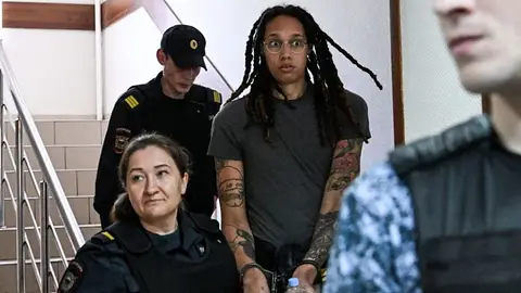 US WNBA basketball superstar Brittney Griner arrives to a hearing at the Khimki Court, outside Moscow on June 27, 2022. - Griner, a two-time Olympic gold medallist and WNBA champion, was detained at Moscow airport in February on charges of carrying in her luggage vape cartridges with cannabis oil, which could carry a 10-year prison sentence.   