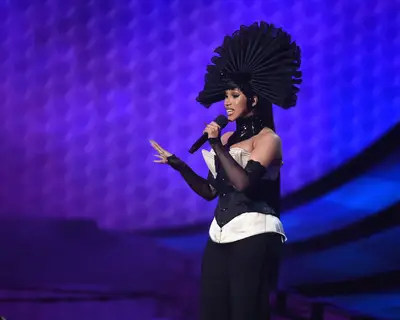 Cardi B Looks Just Like Prince With This Massive Curly Fauxhawk