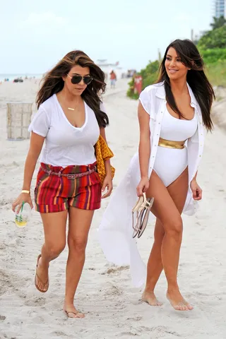 Bonding - Kim Kardashian takes a stroll on Miami Beach with her sister Kourtney Kardashian while filming scenes for Kourtney and Kim Take Miami.&nbsp;(Photo: Brett Kaffee, PacificCoastNews.com)