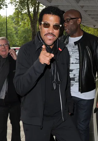 Still on Top - Singer-songwriter Lionel Richie gives a thumbs up to the paps who wait outside the Dorchester Hotel in London as he arrives in town for a series of European tour dates.(Photo: FameFlynet, Inc)