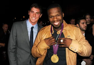 Gold Standard - Olympic swimmer Conor Dwyer lends rapper 50 Cent his Olympic Gold medal to rock at the premiere of Open Road Films' End of Watch at Regal Cinemas L.A. Live. (Photo: Kevin Winter/Getty Images)