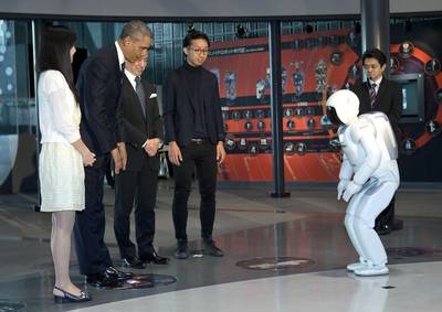 A Scientific Affair - President Obama and ASIMO, an acronym for Advanced Step in Innovative Mobility, bow to each other during a youth science event at the National Museum of Emerging Science and Innovation, known as the Miraikan, in Tokyo, Thursday, April 24, 2014. Showing solidarity with Japan, Obama affirmed Thursday that the U.S. would be obligated to defend Tokyo in a confrontation with Beijing over a set of disputed islands, but urged all sides to resolve the long-running dispute peacefully. (Photo: AP Photo/Carolyn Kaster)