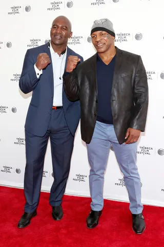 Evander Holyfield and&nbsp;Mike Tyson - Put ‘em up! We think both Evander and “Iron” Mike are knockouts in their casual-cool getups for the screening of Champs.(Photo: Robin Marchant/Getty Images for the 2014 Tribeca Film Festival)