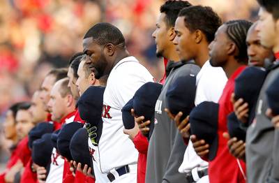 Red Sox Honor Boston Marathon Victims - The Boston Red Sox helped salute survivors of last year’s Boston Marathon bombings at Fenway Park on Sunday. David Ortiz played catcher for Jim Gallagher, the president of One Fund Boston, which has raised $80 million for the bombing victims and their families, who threw out the ceremonial first pitch, as reported by ESPN. The 118th Boston Marathon was held Monday.&nbsp;(Photo: Jim Rogash/Getty Images)