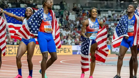 Noah Lyles of the United States and Sha'Carri Richardson of the United States celebrate the team's gold medal win in the Women's and Men's 4x100m Relay during the World Athletics Championships, at the National Athletics Centre on August 26th, 2023 in Budapest, Hungary. (Photo by Tim Clayton/Corbis via Getty Images)