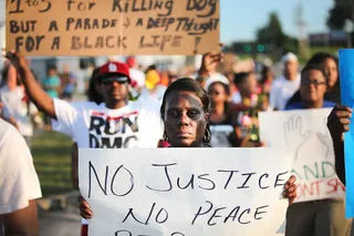 /content/dam/betcom/images/2014/09/Video/090914-video-national-Justice-for-Mike-Brown-protest-sign.jpg