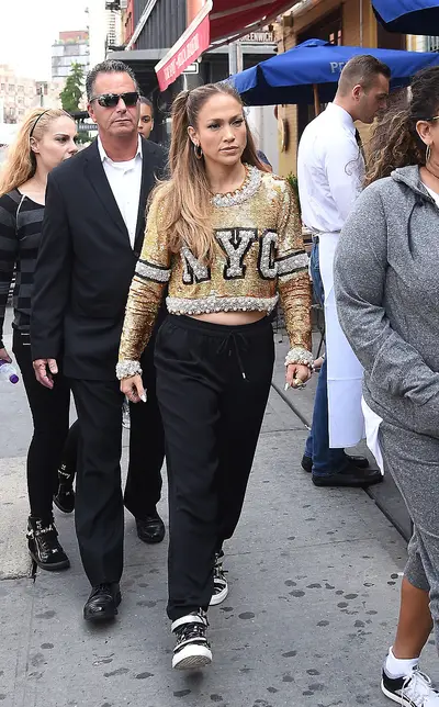 Casual Glam - Jennifer Lopez&nbsp;rocks sweats, sneakers and an embellished crop sweater while out and about in the Chelsea neighborhood of New York City. (Photo: TS, PacificCoastNews)