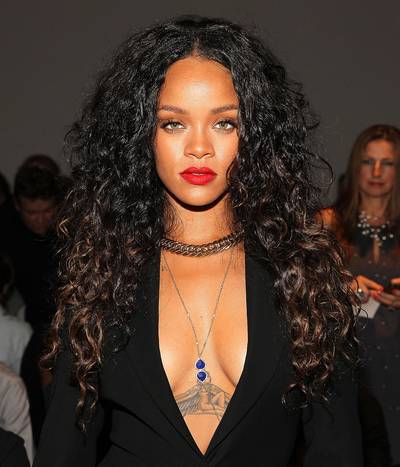Rihanna&nbsp; - Ri works a new coif for New York Fashion Week, coupled here with a severe red lip and luminous skin.  (Photo: Paul Morigi/WireImage)