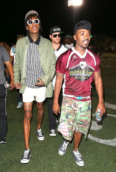 Roll Out - Wiz Khalifa and Ray J&nbsp;arrive at the 2nd Annual Athletes vs. Cancer Celebrity Flag Football Game at Granada Hills Charter High School in Southern California.(Photo: WAB / Splash News)