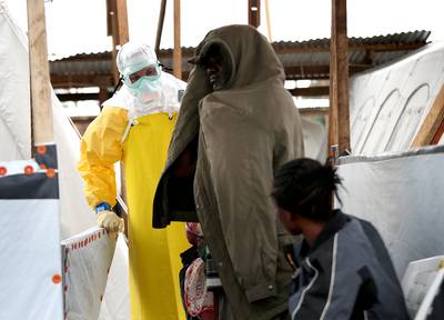 Third American Sickened by Ebola - Boston-based Dr. Rick Sacra became the third American infected with Ebola. Sacra reportedly returned to Liberia after a fellow missionary worker and doctor fell ill with the virus, although he was delivering babies at the missionary group?s hospital and not caring for Ebola patients.&nbsp;(Photo: John Moore/Getty Images)