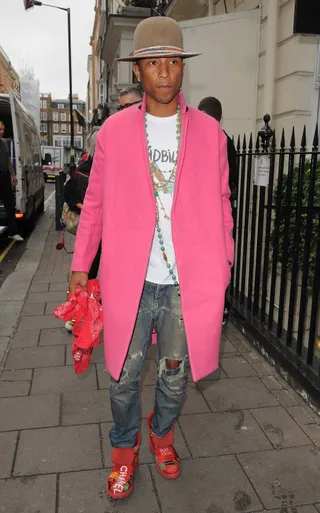 The Stylephile - Pharrell Williams&nbsp;turns heads in a bright pink overcoat and red accessories while shopping at Dover Street Market in NYC.(Photo: TGB / Splash News)