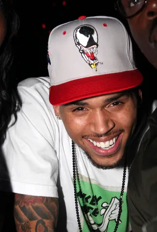 Chris Brown - Chris Brown shoots the cameras a smile while showing off his Venom-inspired hat. Must feel good to bring home four awards.(Photo by Johnny Nunez/WireImage)