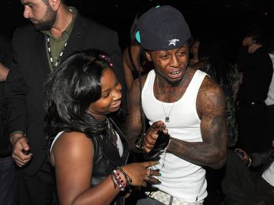 Lil Wayne - A teenage Weezy shouted out his daughter, reality-star-to-be Reginae, on his solo debut,&nbsp;Tha Block Is Hot,&nbsp;rapping, &quot;Sometimes I wish I could just be away / But I gotta take care of Reginae ... Look, I don't curse but in this verse, man, f---the world / I lost my father to the gun and made a little girl.&quot;&nbsp;(Photo: Kevin Winter/Getty Images)&nbsp;
