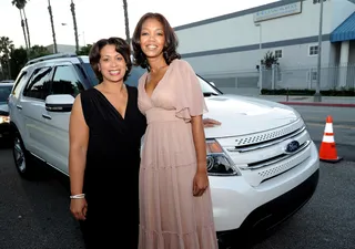 Thank You, Ford - Ford executives Felicia Fields and&nbsp;Shawn Lollie pose in front of the 2011 Ford Explorer parked outside the&nbsp;exclusive fifth annual “PRE” dinner event.(Photo by Earl Gibson/PictureGroup)