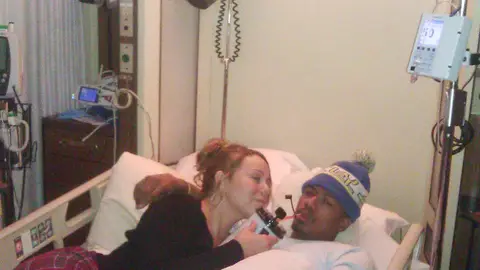 Mariah Carey (@MariahCarey) - TWEET: &quot;Please pray for Nick as he's fighting to recover from a mild kidney failure. #mybraveman.&quot;  Mariah Carey tweets a photo of herself and husband Nick Cannon from his hospital bed after he was rushed to the ER due to mild kidney failure during their family vacation in Colorado.(Photo: Mariah Carey Twitter)