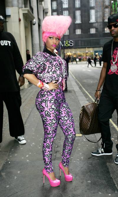 Retro Rapper - Ah, the Franken-do. Pair this hairstyle with several sets of prints — geometric shapes, zebra, stars, polka dots (eh, whatever turns you on) — by way of a track jacket and matching stretch pants. Go bananas and make sure you top it off with big hoops, a pink lip and pink pumps.(Photo : WENN.com)