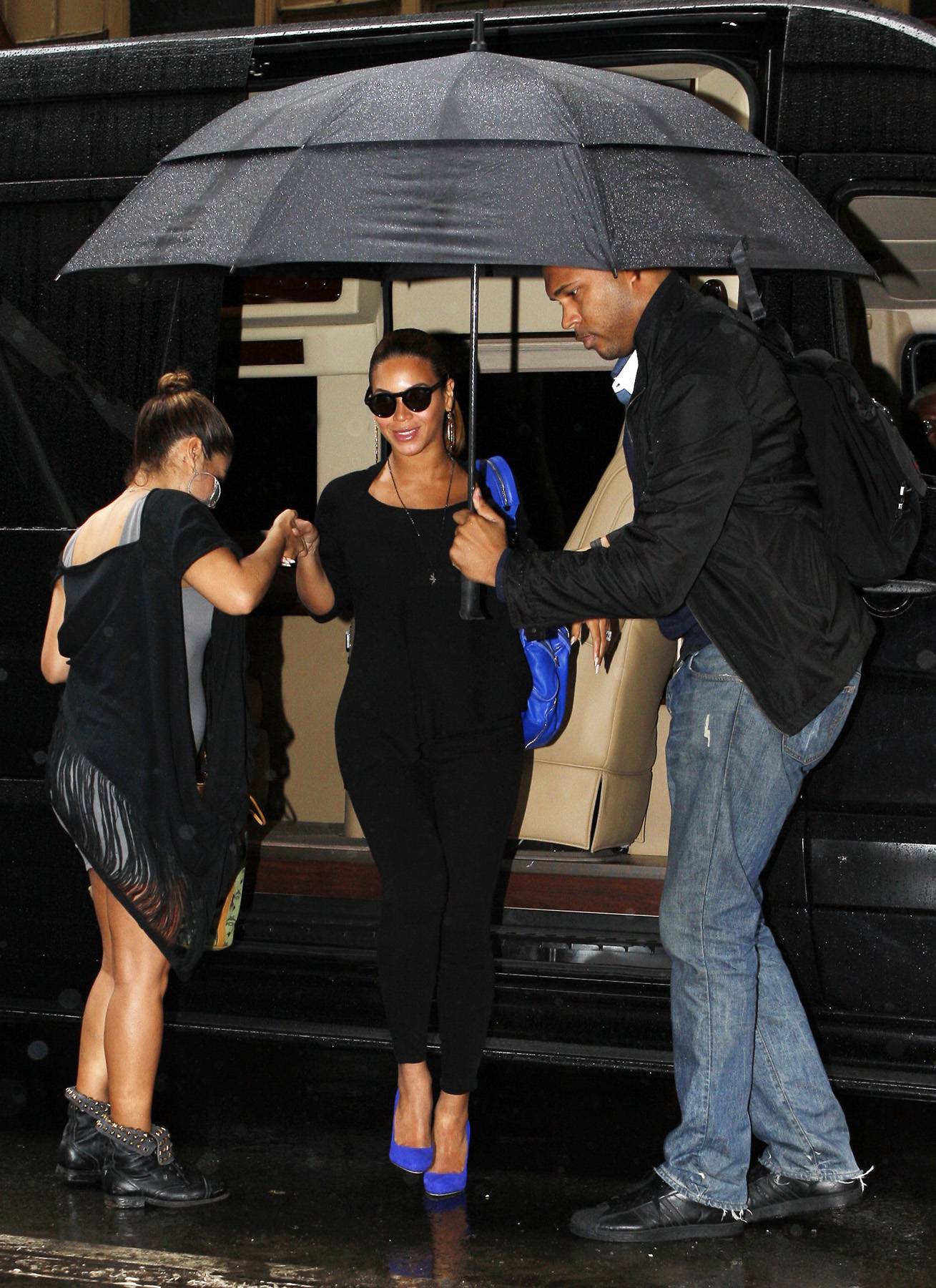 Busy Bey\r - Hot-momma-to-be&nbsp;Beyoncé has been making moves lately, or maybe the paps are on her heels more than usual now that she's carrying precious cargo. Here, she is being helped out of her car and being shielded from the rain by the man who never seems to leave her side, The Bodyguard aka&nbsp;Julius.&nbsp; (Photo: Fame Pictures)