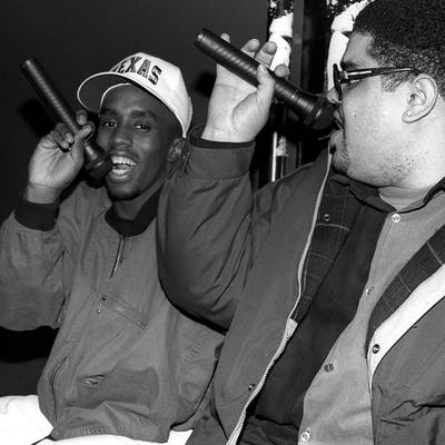 Sean "Diddy" Combs rocks the mic with rapper Heavy D.