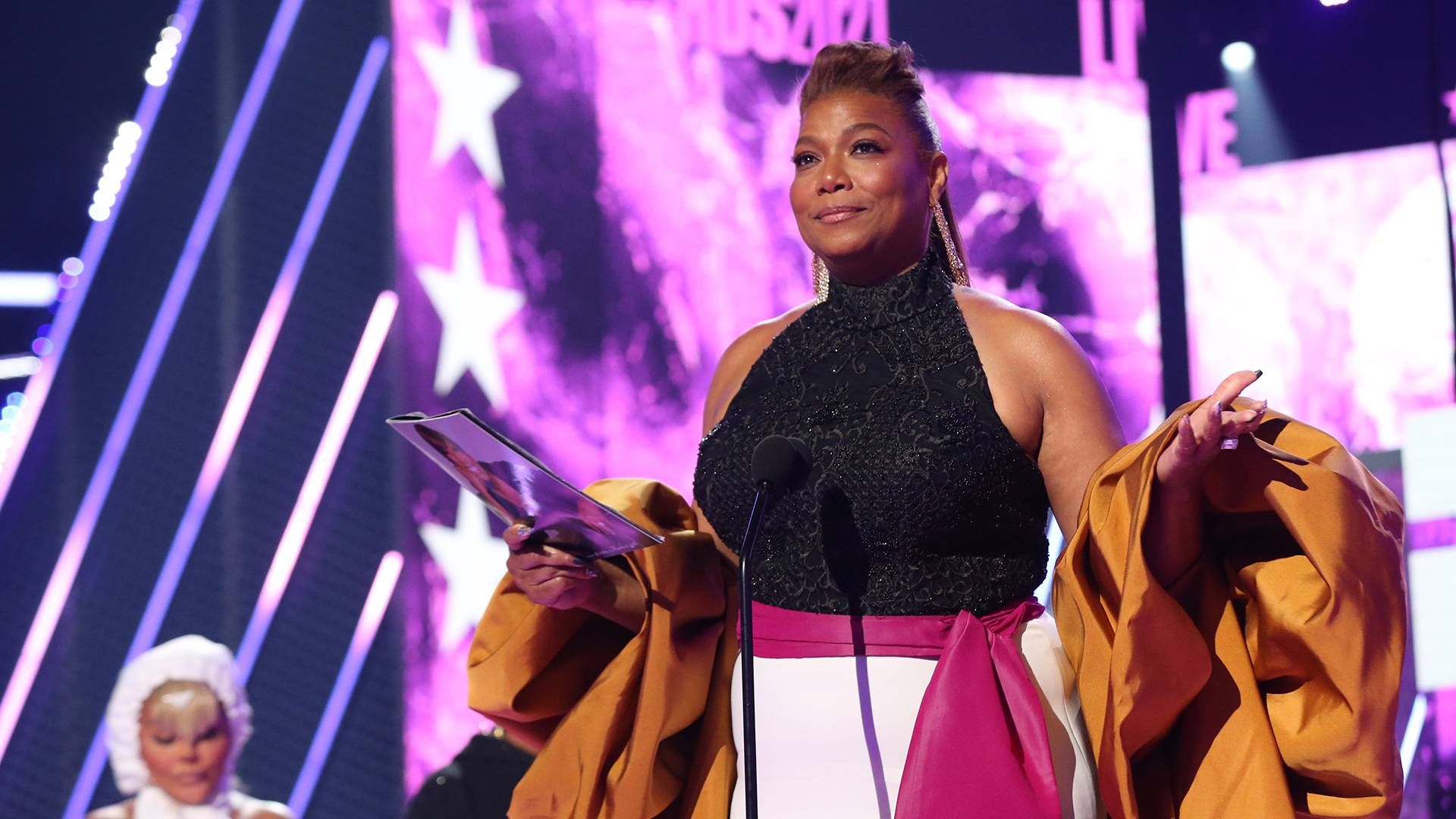 Queen Latifah accepts the Lifetime Achievement Award for her contributions to the entertainment industry and her trailblazing work as a Black businesswoman.