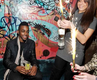 Fireworks - Rapper Roscoe Dash pops bottles at the the VIBE &amp; Roscoe Dash J.U.I.C.E. 2011 holiday party at Gold Bar in New York City. The up-and-coming star performed at the bash as well. (Photo: Mike Coppola/Getty Images)