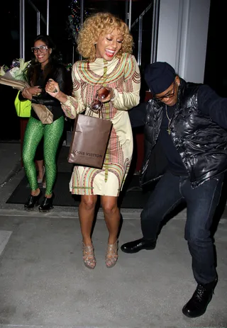 Doing the Most - Keri Hilson has a hearty laugh with friends as she leaves BOA Steakhouse in West Hollywood. The singer is sporting a new curly 'do and more conservative look in this printed sheath dress. (Photo: KPX/WENN.com)