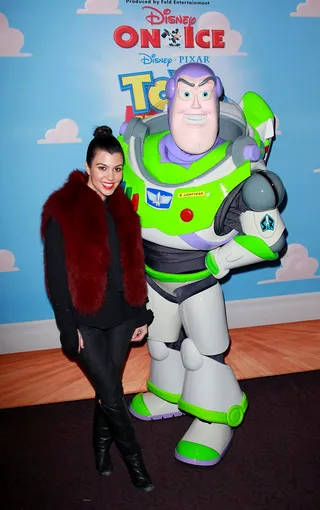 To Infinity and Beyond - Kourtney Kardashian poses with &quot;Buzz Lightyear&quot; at Disney On Ice at the LA Children's Hospital and AEG's Season of Giving Create Holiday Magic on LA Kings Holiday Ice at L.A. LIVE. Where's that cutie Mason? (Photo: David Livingston/Getty Images)