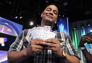 I Got Tickets - Terrence shows tickets to a Lil Kim concert that will be distributed to audience members at 106 &amp; Park, May 18, 2012. (photo: John Ricard / BET)