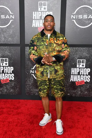 Nelly showcased major swag in this boldly patterned two-piece shorts set. - (Photo by Paras Griffin/Getty Images for BET)