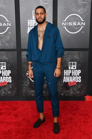 Sarunas J. Jackson arrived in a stylish blue sweatsuit zipped to just the right spot. - (Photo by Paras Griffin/Getty Images for BET)
