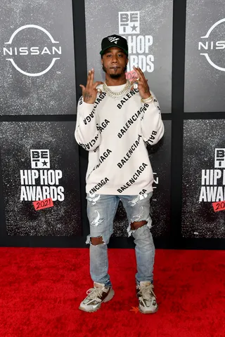 Benny the Butcher kept things fresh and casual with a&nbsp;Balenciaga sweater and ripped jeans. - (Photo by Paras Griffin/Getty Images for BET)