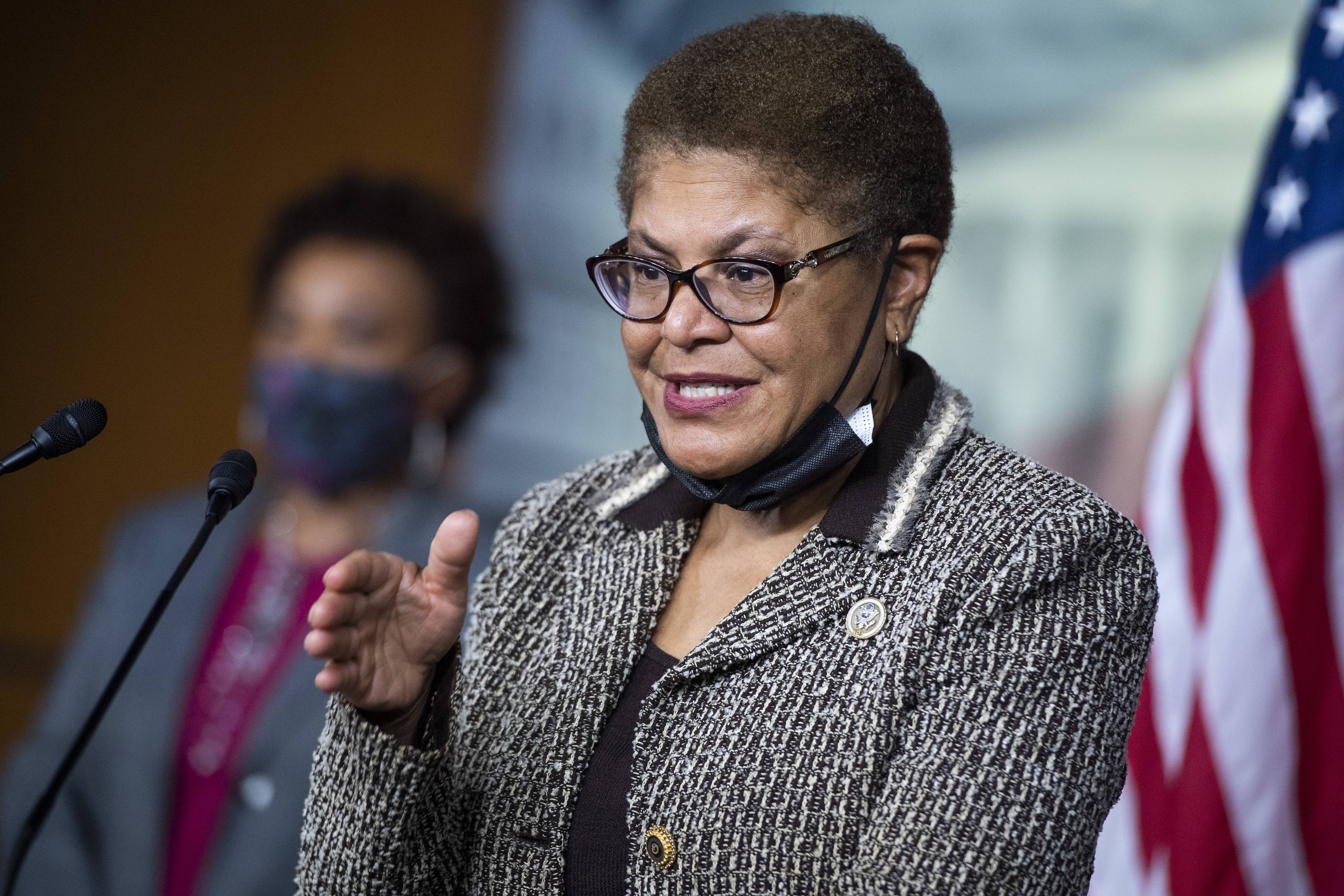 UNITED STATES - SEPTEMBER 23: Rep. Karen Bass, D-Calif., chair of the Congressional Black Caucus, and Rep. Barbara Lee, D-Calif., left, conduct a news conference on the Jobs and Justice Act of 2020, which aims to increase the upward social mobility of Black families, and help ensure equal protection under the law, in the Capitol Visitor Center on Wednesday, September 23, 2020. (Photo By Tom Williams/CQ-Roll Call, Inc via Getty Images)