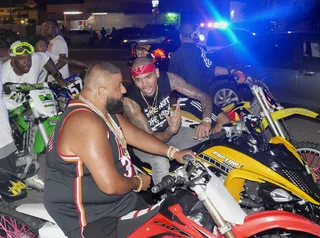 Talk It Out - Chris Brown confers with DJ Khaled between takes.  (Photo: Splash News)