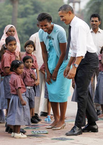 Dateline: New Delhi, Nov. 7, 2010 - The president and First Lady Michelle Obama greet the children of workers who restore New Delhi's historical buildings during a tour of Humayun's tomb in New Delhi.  (Photo: Jason Reed/Reuters)