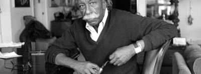 Gordon Parks - Gordon Parks was just as prolific as the subjects he captured on camera, often bringing flavor to the job in a power trench, using his signature mustache and pipe to lend individuality to his look. Aside from his distinguished style, Parks was the first African-American to work as a staff photographer for Life magazine and the first African-American to direct a major motion picture.  (Photo: Adger Cowans/Getty Images)