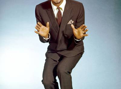 Sammy Davis Jr. - Dignity, confidence, attitude and a fine eye for all things fly kept these men on our radar then and now. Join us in celebrating 10 Black style pioneers with impeccable swag.&nbsp;   Sammy Davis Jr. was the first African-American to appear on the cover of GQ magazine in September 1967. The Harlem-born Rat Packer had an affection for tailored suits and sharp footwear and was never one to shy away from whimsical accessories, like the polka-dot tie and satin pocket square he’s pictured in here.&nbsp;By: Metanoya Z. Webb  (Photo: Silver Screen Collection/Getty Images)