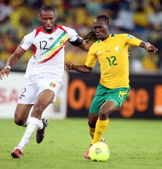 Mali v. South Africa - Seydou Keita of Mali competes with Reneilwe Letsholonyane of South Africa during the quarterfinal match on Feb. 2. (Photo: Steve Haag/Getty Images)