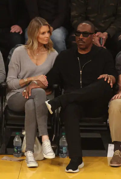 Eddie Murphy and Paige Butcher - Eddie Murphy and his girlfriend, Paige Butcher, sit courtside at a Lakers game. The 38-year-old actress&nbsp;is the mother of Eddie Murphy's ninth child, Izzy Oona Murphy. (Photo: London ENT/ Splash News)