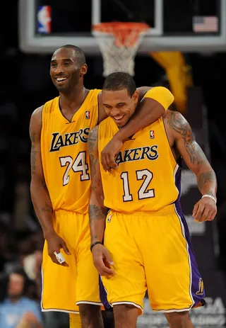 Follow My Lead - Kobe sure looks friendly with former Los Angeles Lakers teammate&nbsp;Shannon Brown.&nbsp;Maybe he was just proud of him for wifing up Monica.(Photo: Lisa Blumenfeld/Getty Images)
