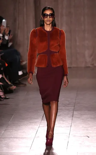 Zac Posen - Feeling mod? Get into this ‘60s-inspired fur-trimmed jacket and skirt combo in shades of burnt orange and burgundy.&nbsp;  (Photo: Neilson Barnard/Getty Images)