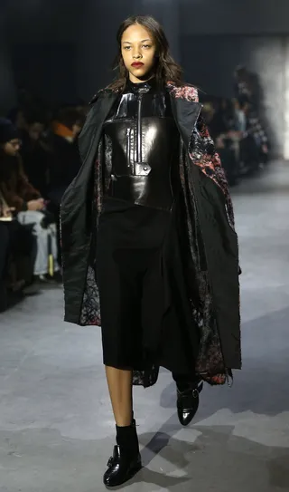 3.1 Phillip Lim - This zip-front coat brings the drama with a calf-length hemline and an all-over textured print. Tip: leather separates to go underneath are a must. (Photo: Neilson Barnard/Getty Images)