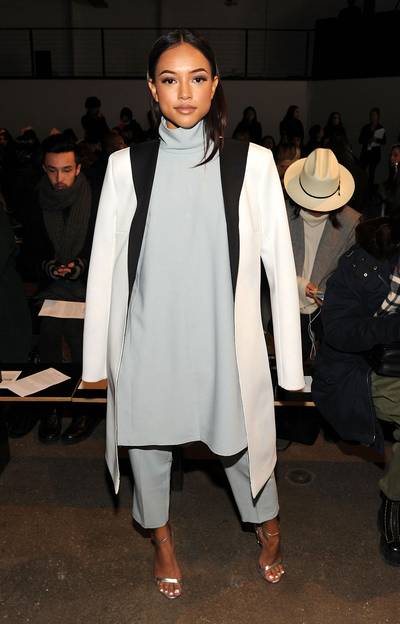 New York City Chic - Karrueche Tran,&nbsp;in an oversize shirt, overcoat and tapered slacks, strikes a pose inside the Adeam fashion show at Highline Stages during NYFW in New York City.(Photo: Craig Barritt/Getty Images)