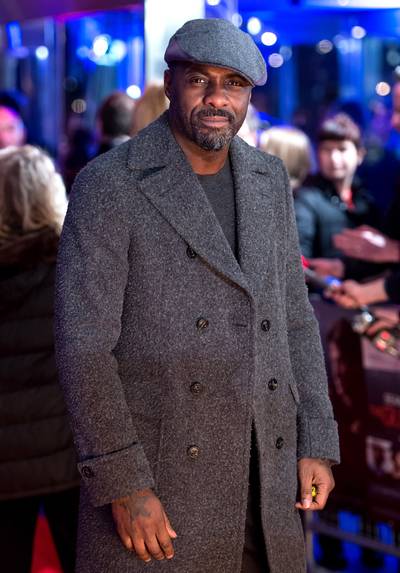 The Dapper Gent - Idris Elba&nbsp;is as handsome as ever with a scruffy 5 o'clock shadow and pageboy cap at the world premiere of The Gunman at BFI Southbank in London.(Photo: Ian Gavan/Getty Images)