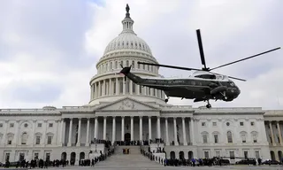 On His Way Out - A Marine helicopter with former President George W. Bush on board departs from the East Front of the U.S. Capitol. (Photo: AP Photo/Tannen Maury, Pool)