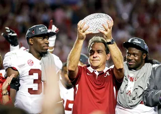 Another One for the Mantle - Crimson Tide head coach Nick Saban holds up the championship trophy.&nbsp;Saban now has won four national championships.&nbsp; (Photo: Chris O'Meara/AP Photo)