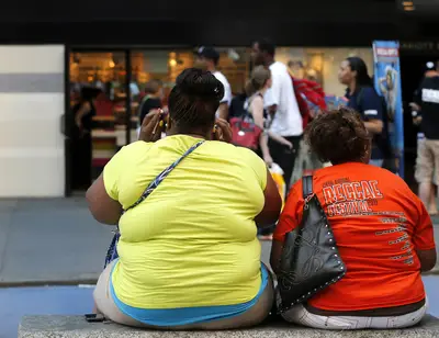 Health Rewind: Is DNA to Blame for High Obesity Rates Among Blacks? - A recent study suggests that DNA may be behind Black obesity rates in the U.S. Researchers from Dartmouth found that African-Americans have three variant genes that predispose us to obesity and a higher Body Mass Index (BMI), reported the Huffington Post. Unhealthy eating and lack of exercise also play a huge role too.&nbsp;&nbsp;(Photo: REUTERS/Brendan McDermid)